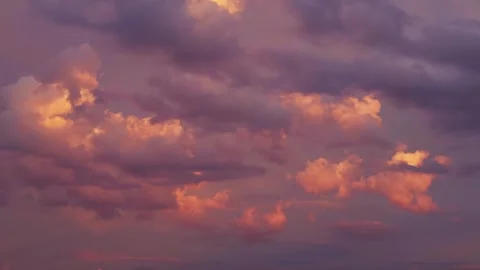 Dramatic cloudscape illuminated by the light of the setting sun. Timelapse video Stock Footage 275540413