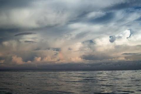 Dramatic Cloudscape Over Calm Ocean Horizon in Mauritius Stock Photos