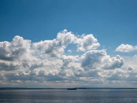 Dramatic Cloudscape Over Calm Open Water Фото