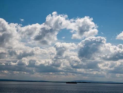 Dramatic Cloudscape Over Calm Seascape Photos