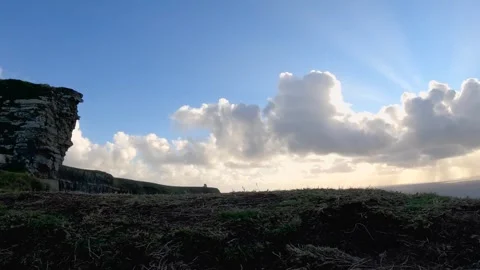 Dramatic cloudscape over Cliffs of Moher and Atlantic Ocean waves RISE REVAL Stock Footage 303552405