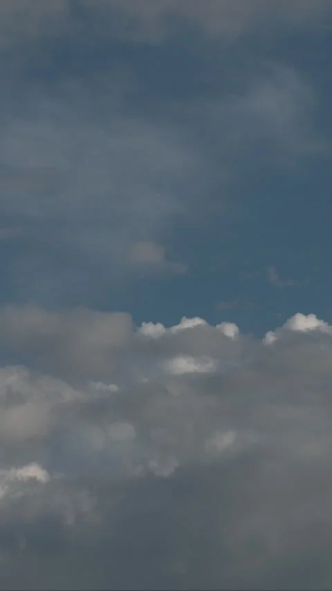 Dramatic Cloudscape Over Dark Blue Sky With Storm Clouds and Moody Atmospheric L Stock Footage 335750039