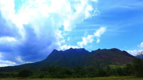 Dramatic Cloudscape Over Mountain Range Landscape 動画素材 311587104