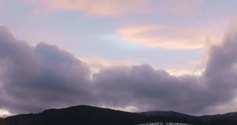 Dramatic Cloudscape Over Mountain Range at Sunset Stock Footage 323126452