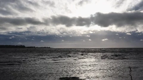 Dramatic Cloudscape over Ocean at Sunset with Glistening Waves Stock Footage 271199003