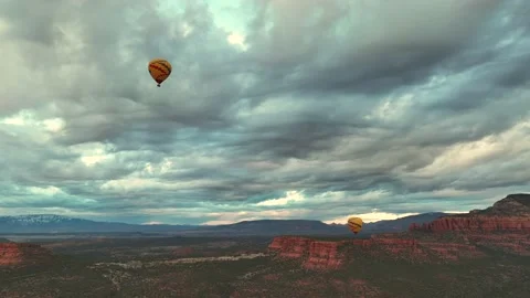 Dramatic Cloudscape Over Sedona Red Rock Cliffs With Flying Hot Air Stock Footage 237456002