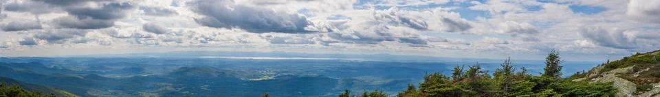 Dramatic cloudscape over Vermont rural valley with Lake Champlain in distance Stock Photos