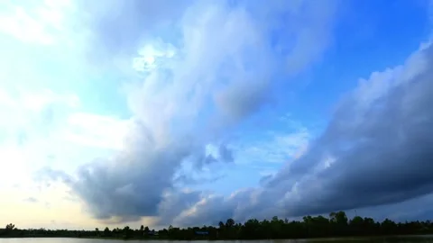 Dramatic Cloudscape Over Water at Dawn or Dusk Stock Footage 310923495