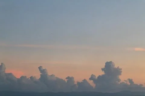 Dramatic cloudscape with pastel sky at sunrise showing unique cloud formation 스톡 사진