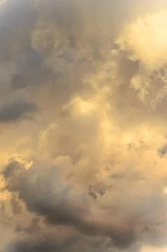 Dramatic cloudscape scene, colored sun lights on the blue sky, fluffy clouds 스톡 사진