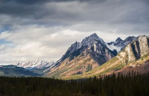 Dramatic Cloudscape Sky and Distant Snowcapped Mountain Peaks Canadian Rockies Stock Photos