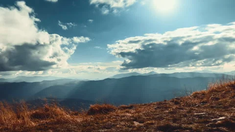 Dramatic cloudscape with sun rays white clouds Stock Footage 254158515