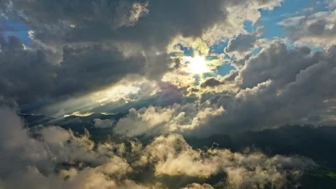 A Dramatic Cloudscape with Sunlight Brilliantly Breaking Through the Clouds of Stock Footage 318146607
