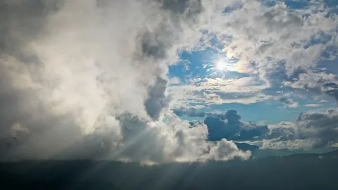 Dramatic Cloudscapes Featuring Sunlight Majestically Breaking Through the Vídeos de archivo 317817978