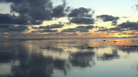 Dramatic cloudy and colorful sunset over the ocean Stock-Footage 84981168