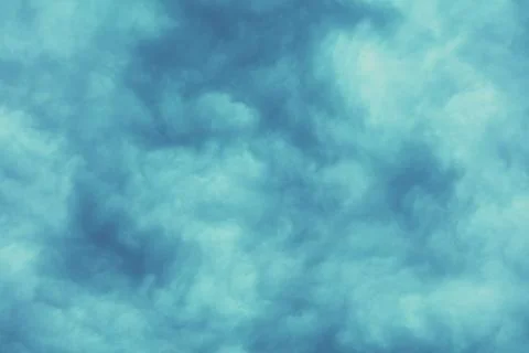 Dramatic cloudy blue sky. Overcast sky texture, abstract nature background Stock Photos