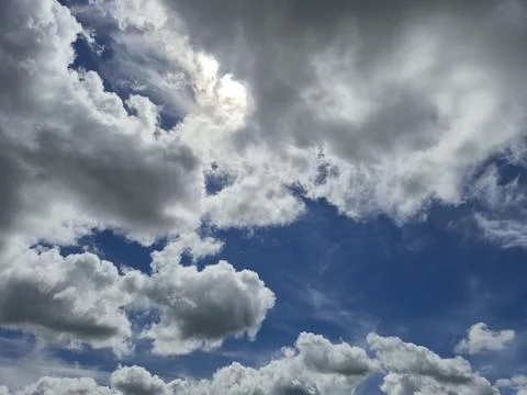Dramatic cloudy blue sky with sunlight Stock Photos