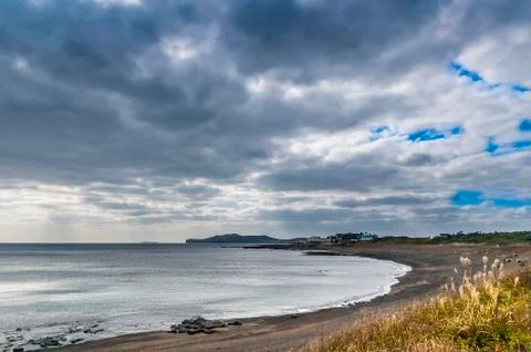 Dramatic cloudy breathtaking view of Yongmoeri Hyean, Jeju Island Stock Photos