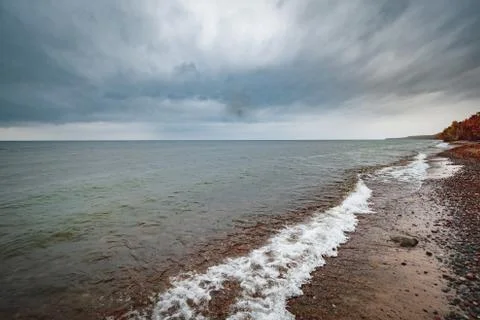 Dramatic cloudy horizon over the great lakes superior in autumn Stock Photos