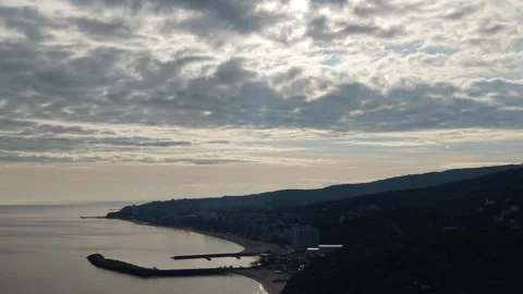 Dramatic cloudy sky above calm sea captured by cinematic drone footage Stock Footage 322902099