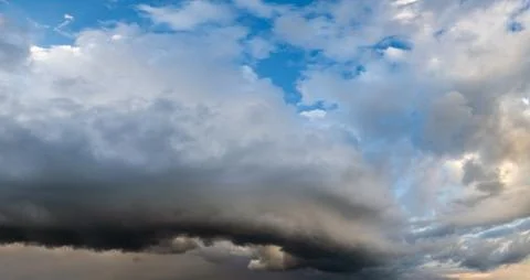 Dramatic cloudy sky with circular thunderstorm cloud Stock Photos