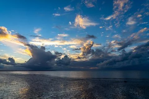 Dramatic cloudy sky during golden hour Stock Photos