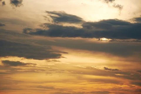 Dramatic cloudy sky in the dusk sunlight Stock Photos