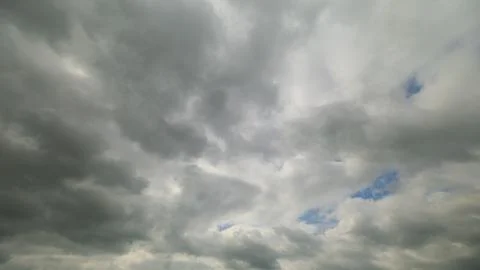 A Dramatic Cloudy Sky with Dynamic Light Patterns that Captivates the Viewer and Stock Photos