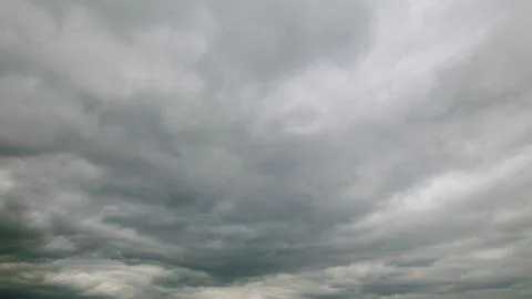 Dramatic Cloudy Sky featuring Layers of Various Gray Clouds Creating a Unique At Stockfoto's
