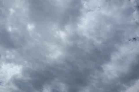 Dramatic cloudy sky full frame with dynamic cloud formations Stock Photos