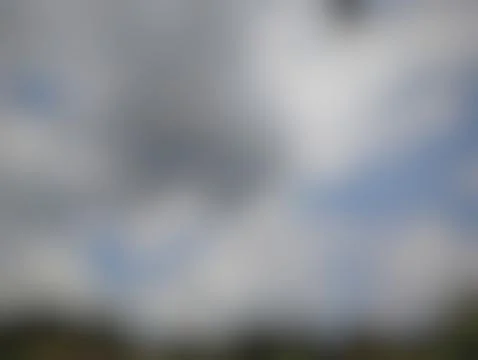 Dramatic Cloudy Sky with Hints of Blue and Overcast Conditions Stock Photos