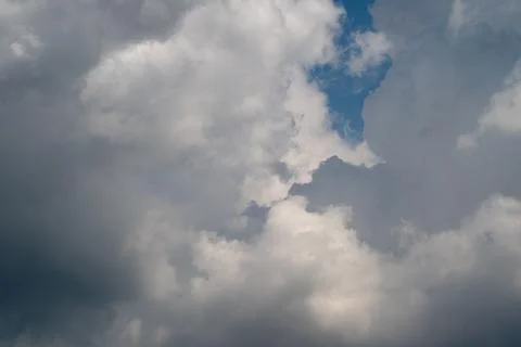 Dramatic cloudy sky with layered cumulus and sunlight Photos