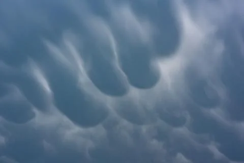 Dramatic cloudy sky: an ominous sense of an upcoming storm Stock Photos