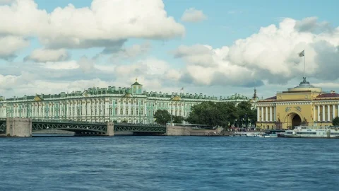 Dramatic cloudy sky over the Bridge and Winter Palace with boats Stock Footage 115507599