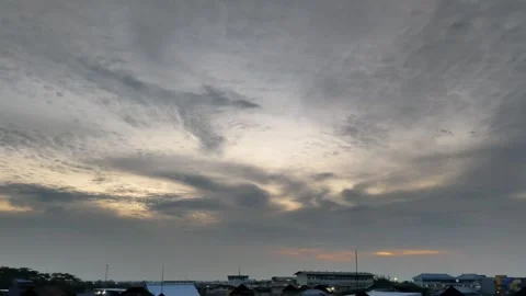 Dramatic Cloudy Sky Over a City Scape at Dusk Stock Footage 305370186