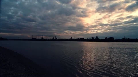 Dramatic cloudy sky over Danube and industrial plant Voest in Linz Stock Footage 147024215