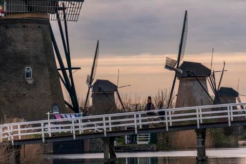 Dramatic cloudy sky over the famous Windmills in Kinderdijk Holland. Sunny Stock Photos