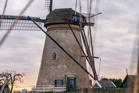 Dramatic cloudy sky over the famous Windmills in Kinderdijk Holland. Sunny Stock Photos