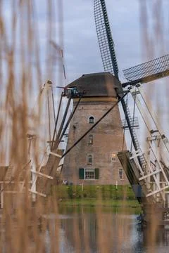 Dramatic cloudy sky over the famous Windmills in Kinderdijk Holland. Sunny Stock Photos