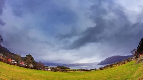 Dramatic Cloudy Sky Over Fjord Valley Landscape Stock Footage 310243062