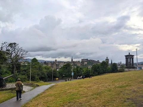 Dramatic cloudy sky over the historic Edinburgh skyline and castle from Calton Stock Photos