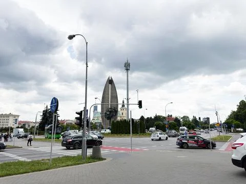 Dramatic cloudy sky over monument and busy urban intersection in Rzeszow, P.. Stock Photos