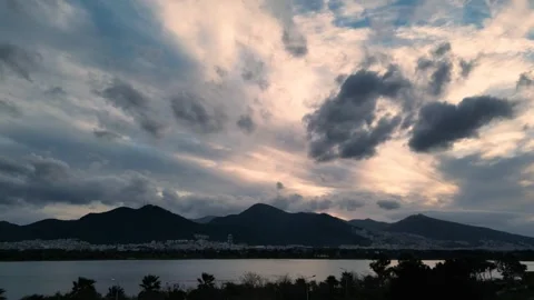 Dramatic Cloudy Sky Over Mountain and City Silhouette Stock Footage 321231895