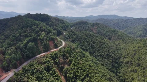 Dramatic Cloudy Sky Over Mountain Road Landscape Stock Footage 329817915