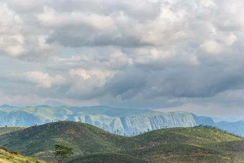 Dramatic Cloudy Sky Over Rolling Green Hills and Mountains in Kerala Stock Photos