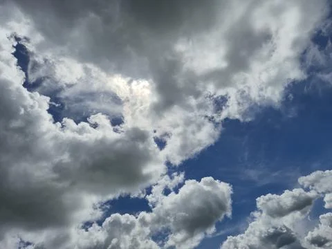 Dramatic cloudy sky with patches of blue 写真素材