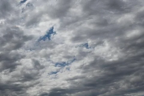 Dramatic cloudy sky with patches of blue Foto stock