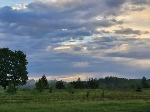 Dramatic cloudy sky before rain over countryside Stock Photos