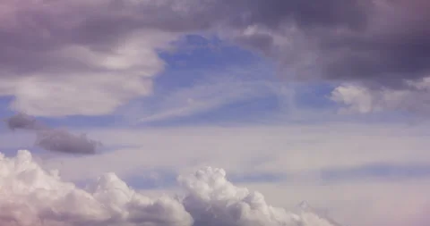 Dramatic cloudy sky with a soft opening of blue light Vidéo 336393707