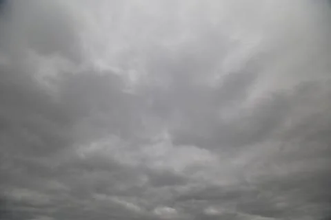 Dramatic cloudy sky before storm, heavy cloud banks and deep gray gradients.. Stock Photos